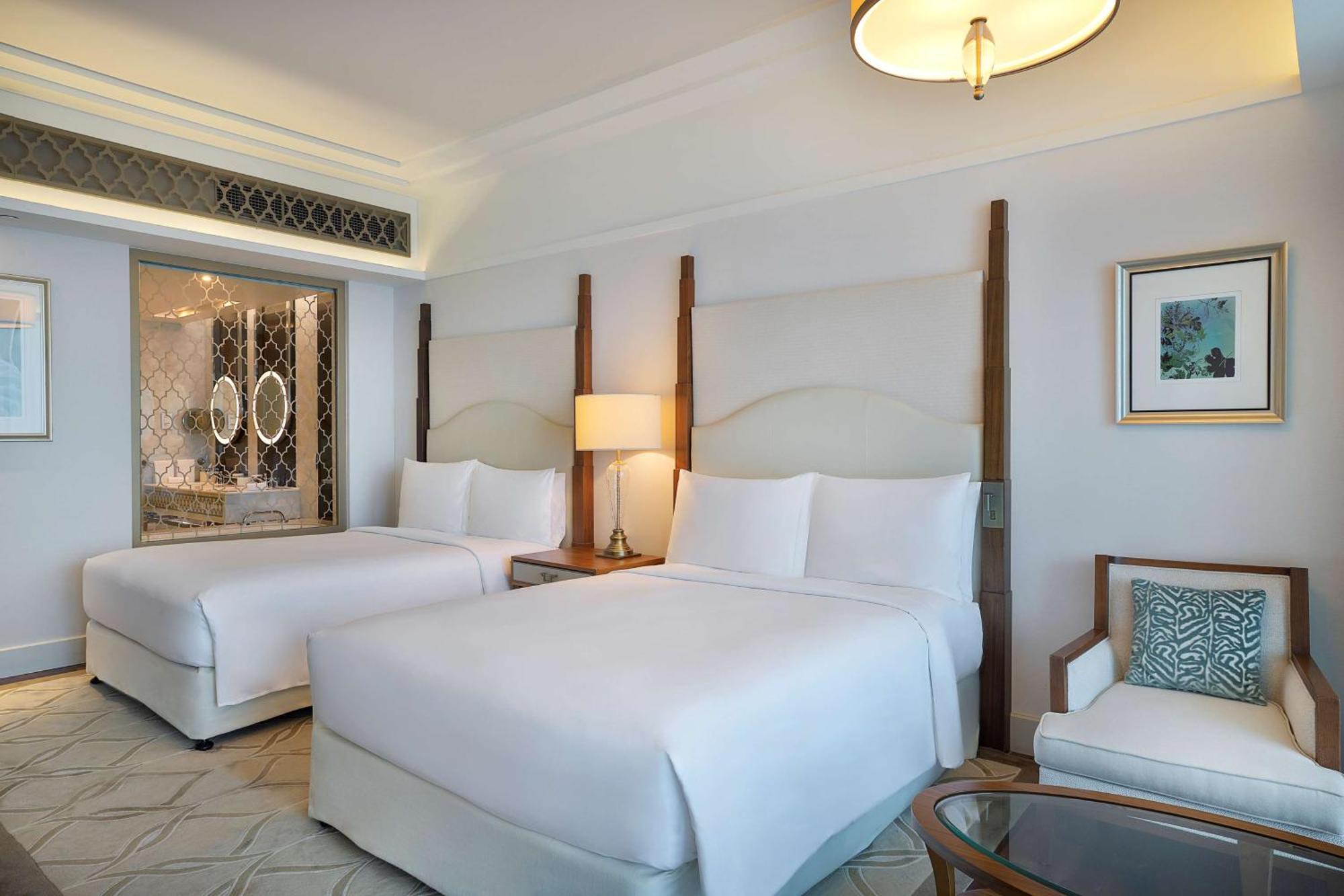 Deluxe Queen Room with Two Queen Beds and Palm Sea View