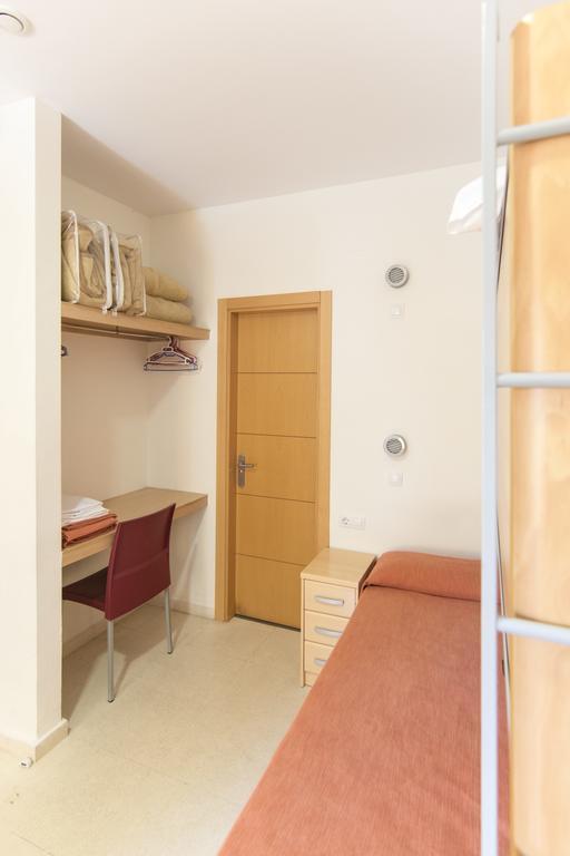 Single Bed in Dormitory Room